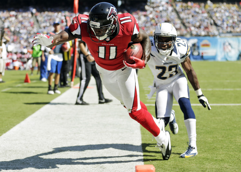 Atlanta Falcons wide receiver Julio Jones (11) hauls in a touchdown pass over San Diego Chargers cornerback Quentin Jammer during the first half of an NFL football game in San Diego, Sunday, Sept. 23, 2012. (AP Photo/Gregory Bull)