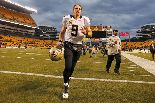 New Orleans Saints quarterback Drew Brees (9) runs off the field after a 35-32 win over the Pittsburgh Steelers in an NFL football game at Heinz Field in Pittsburgh, Sunday, Nov. 30, 2014. (AP Photo/Gene J. Puskar) ORG XMIT: PAGP