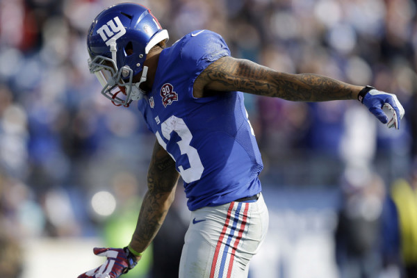 New York Giants wide receiver Odell Beckham Jr. (13) celebrates a 15-yard touchdown pass against the Tennessee Titans in the first half of an NFL football game Sunday, Dec. 7, 2014, in Nashville, Tenn. (AP Photo/Mark Zaleski)