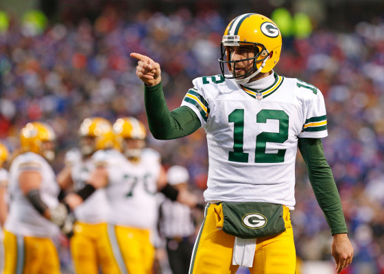 Dec 14, 2014; Orchard Park, NY, USA; Green Bay Packers quarterback Aaron Rodgers (12) gestures during the game against the Buffalo Bills at Ralph Wilson Stadium. The Bills beat the Packers 21-13. Mandatory Credit: Kevin Hoffman-USA TODAY Sports
