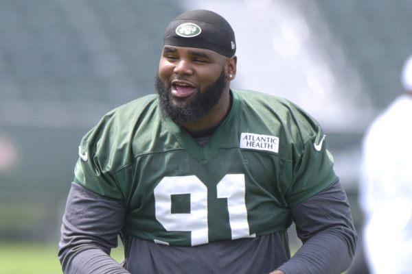 07/30/15 - New York Jets' Sheldon Richardson (91) stretches at training camp. Photo by Bill Kostroun