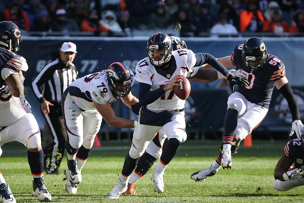 CHICAGO, IL - NOVEMBER 22: Quarterback Brock Osweiler #17 of the Denver Broncos carries the football in the third quarter against the Chicago Bears at Soldier Field on November 22, 2015 in Chicago, Illinois. (Photo by Jonathan Daniel/Getty Images)