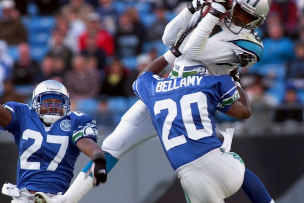 Carolina Panthers' Donald Hayes (81) is hit by Seattle Seahawks' Jay Bellamy (20) and Willie Williams (27) after a catch in the second quarter Sunday, Oct. 8, 2000, at Ericsson Stadium in Charlotte, N.C. (AP Photo/Erik Perel)