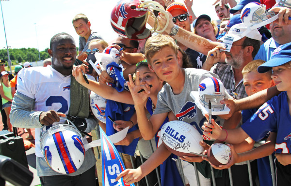 Buffalo Bills running back LeSean McCoy (25) poses with fans during their NFL football training camp in Pittsford, N.Y., Friday, July 31, 2015. (AP Photo/Bill Wippert)