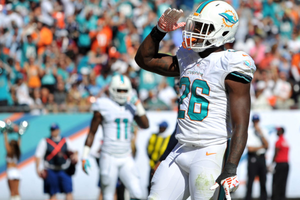 Nov 2, 2014; Miami Gardens, FL, USA; Miami Dolphins running back Lamar Miller (26) celebrates after scoring a touchdown against the San Diego Chargers during the first half at Sun Life Stadium. Mandatory Credit: Steve Mitchell-USA TODAY Sports ORG XMIT: USATSI-180266 ORIG FILE ID: 20141102_ads_su8_099.JPG