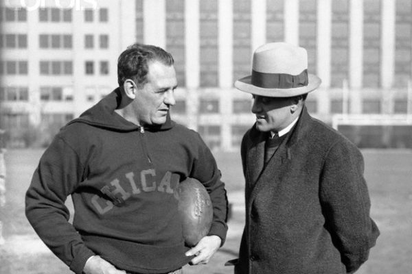 Original caption: Red grange, backfield star (left), and George Halas, coach and onwer of the Chicago Bears, are discussing the strategy to be used in the coming professional; championship match with the New York Giants. --- Image by © Bettmann/CORBIS