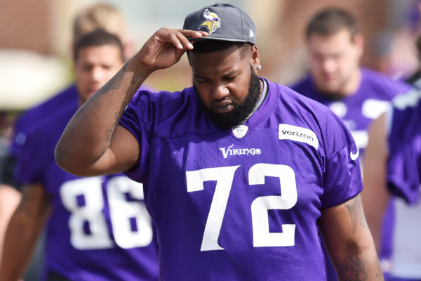 Minnesota Vikings offensive lineman Andre Smith adjusts his cap as he walks to the morning walk-thru on the second day of the Minnesota Vikings training camp at Minnesota State University in Mankato on Saturday, July 30, 2016. (Pioneer Press: John Autey)