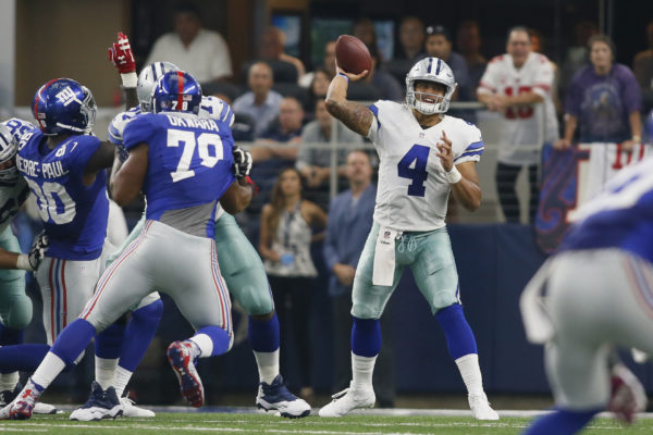 Sep 11, 2016; Arlington, TX, USA; Dallas Cowboys quarterback Dak Prescott (4) throws a pass in the fourth quarter against the New York Giants at AT&T Stadium. New York won 20-19. Mandatory Credit: Tim Heitman-USA TODAY Sports