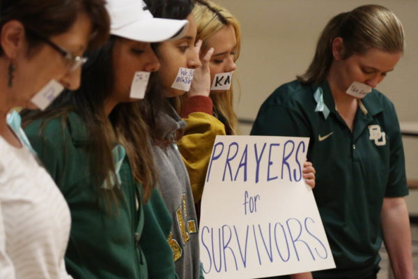 Current and former Baylor students hold a rally warning of sexually assaults on and off campus, Friday, June 3, 2016, in Waco, Texas. Calling the rally Un-silence the Survivors, they read an open letter to the administration about improvements on how the school should handle sexual assaults after observing a moment of silence. (Rod Aydelotte/Waco Tribune Herald, via AP)