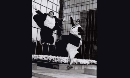 women jumping in front of companies Women on boards