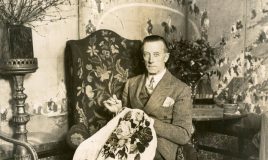 man doing needlework, feminist party (Atria) man doing needlework, feminist party (Atria)