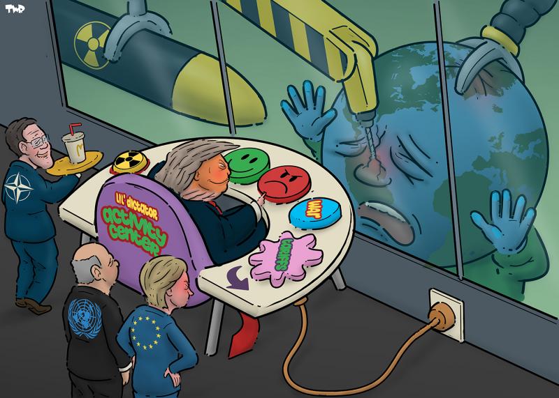 Cartoon showing Donald Trump sitting in a giant baby activity center chair with large colorful buttons in front of him labeled with the symbol of nuclear weapons and 'War' and 'Tariffs'. He is positioned in front of a large viewing glass. Behind the glass the earth is desperately holding his hands to the glass while a machine drills a hole in Venezuela and a large claws grabs Greenland. Behind Trump stand someone from the UN (doing nothing), Usrsula von der Leyen from te EU (looking angrily at the plug that