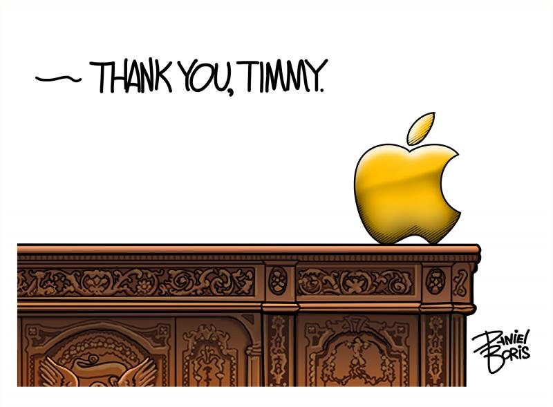 A golden apple seen placed at the edge of the resolute desk. Thank you, Timmy.