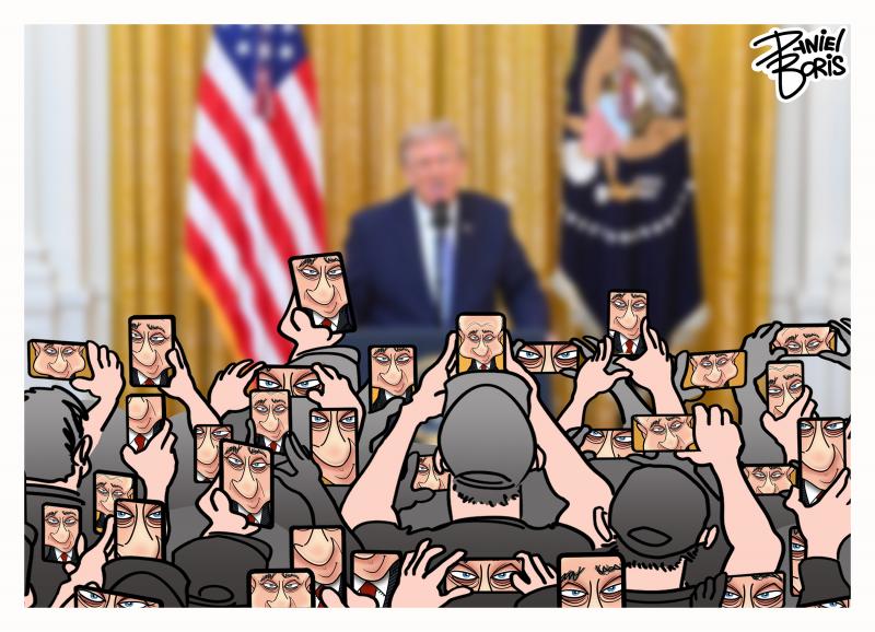 Blurred photo of Donald Trump speaking in the east wing of the White House. In the foreground is a crowd of people all holding up cell phones, recording Trump. In all of the cell phone screens is seen Putin's smirking face.