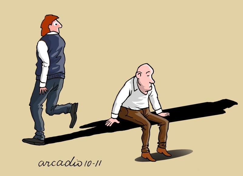 A man sitting on a shadow.