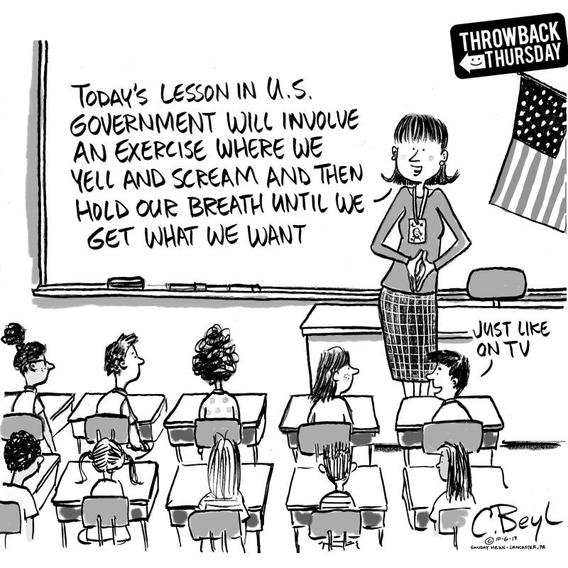 Teacher addressing classroom of kids about US government