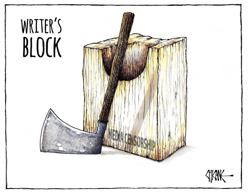 'Writer's block'-an axe and a beheading block of wood, labelled 'media censorship.'