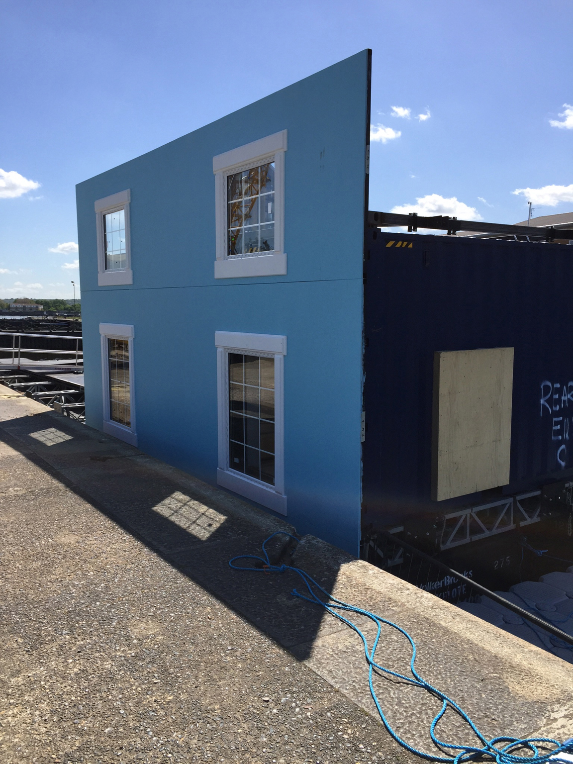 The floating house was prefabricated by a team of 40 at Set Square, then assembled on a floating platform at London's Royal Docks. Walls were painted in weatherproof pain