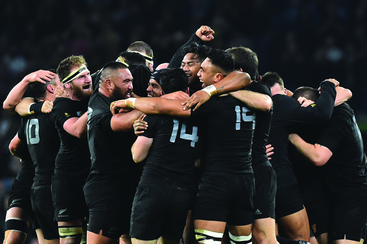 New Zealand's players celebrate after winning the final match of the 2015 Rugby World Cup between New Zealand and Australia at Twickenham stadium, south west London, on October 31, 2015.