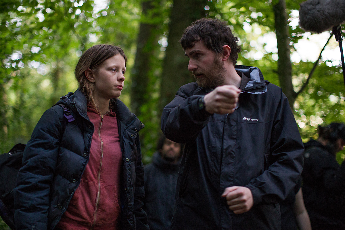 Director Stephen Fingleton on set of The Survivalist with Mia Goth