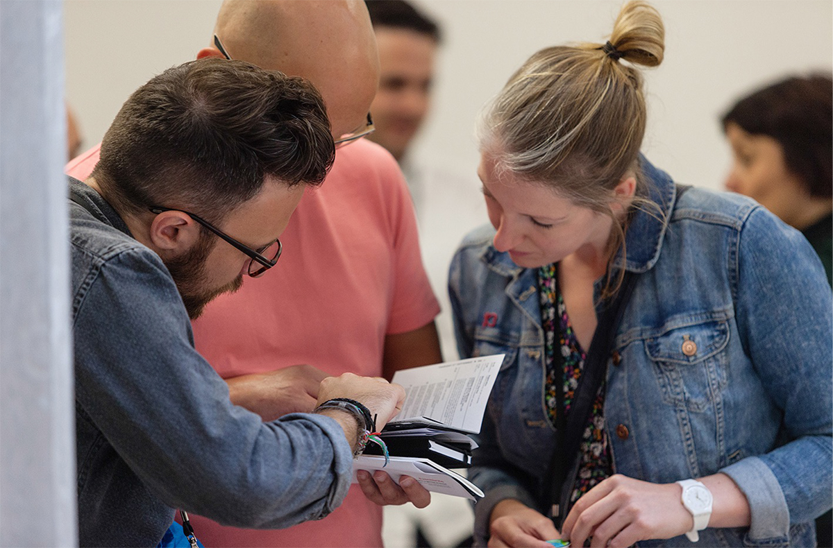 David Wrenne (Cardiff School of Art and Design) and Laura Walker (Arts University Bournemouth) review the programme for which sessions to attend. Photo: Alex Lloyd Jenkins