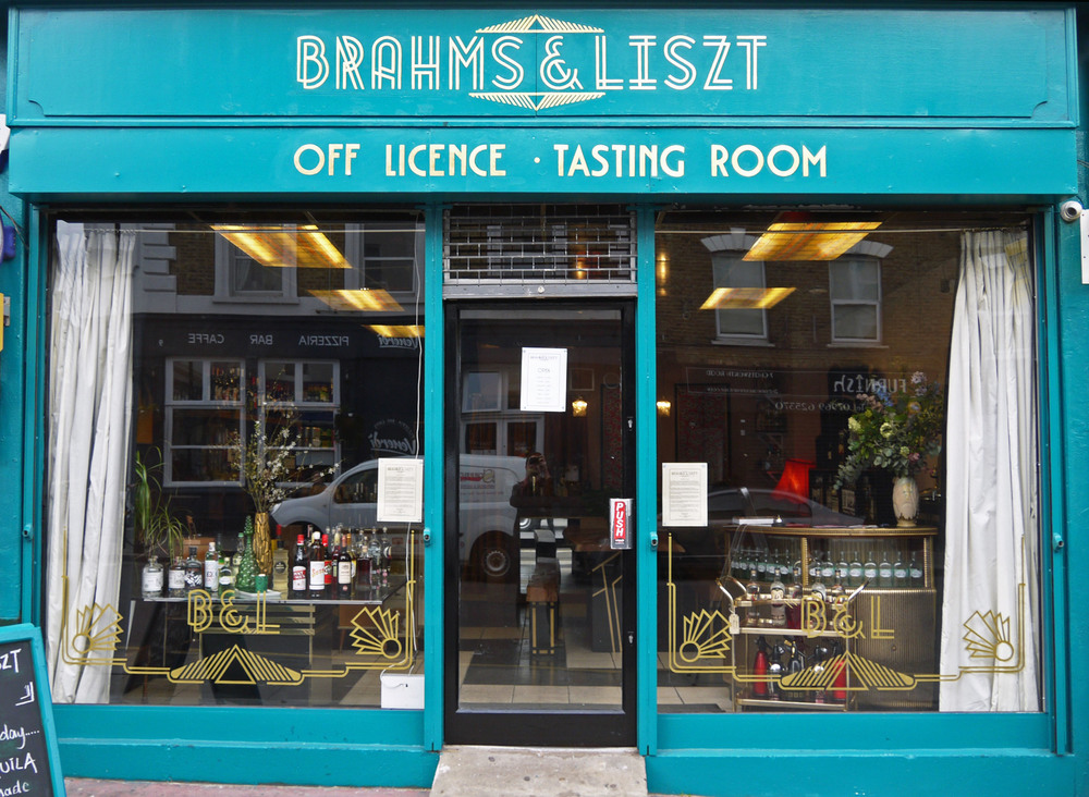 Shop fascia and window display for an off licence on Chatsworth Road, East London