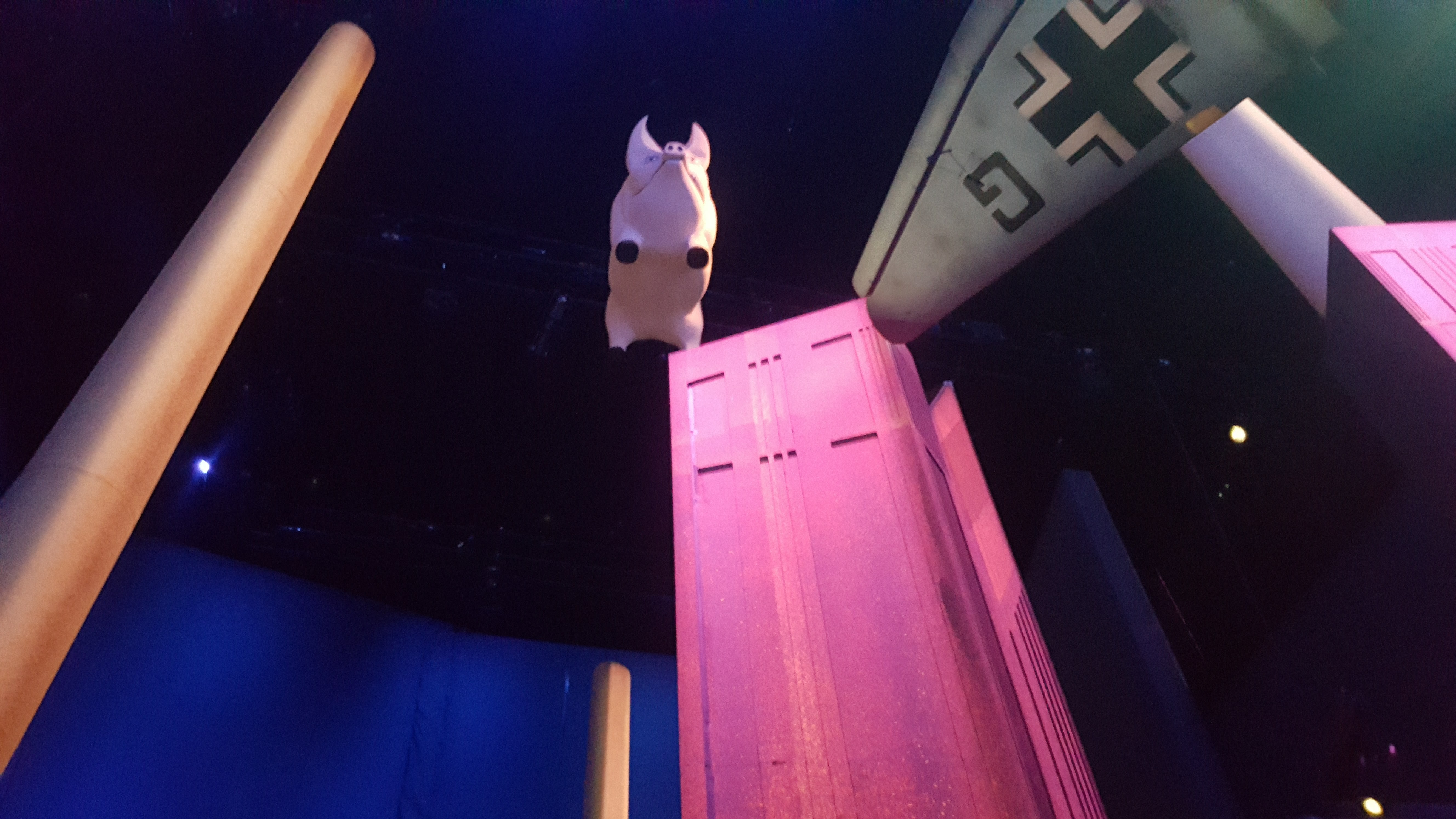 A pink pig is suspended from the ceiling above Stufish's Battersea Power Station installation