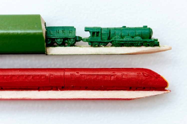 Minute sculptures of The Flying Scotsman and Virgin Azuma by