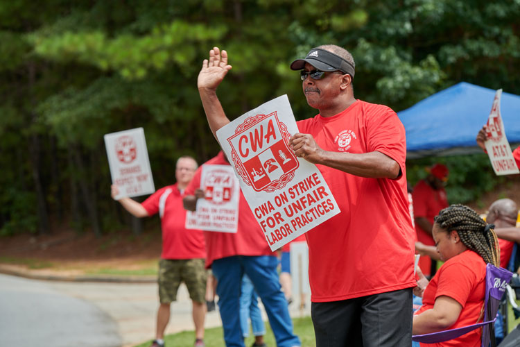 CWA members at a previous demonstartion protesting AT&T.