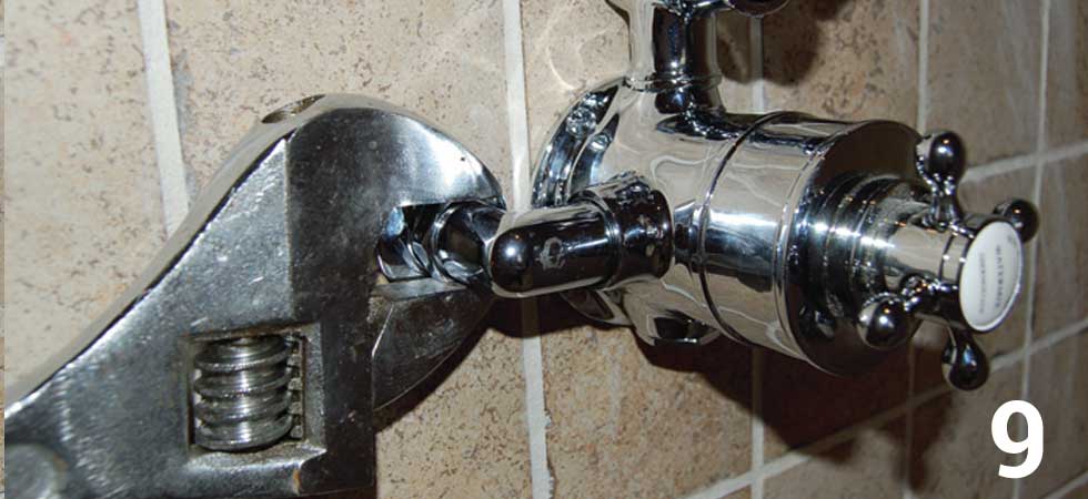 Screw the valve to the wall and then tighten the retaining nuts with an adjustable spanner