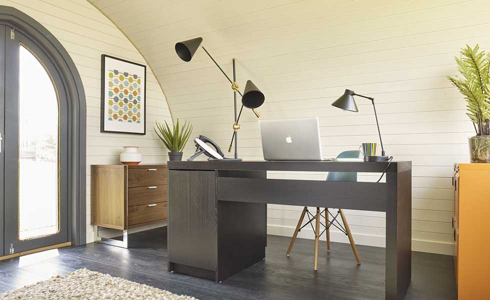 garden office pod with desk and curved roof