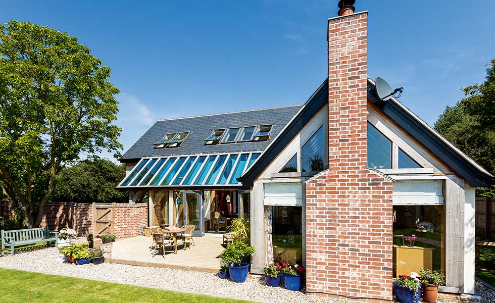 sips and oak frame home with brick chimney