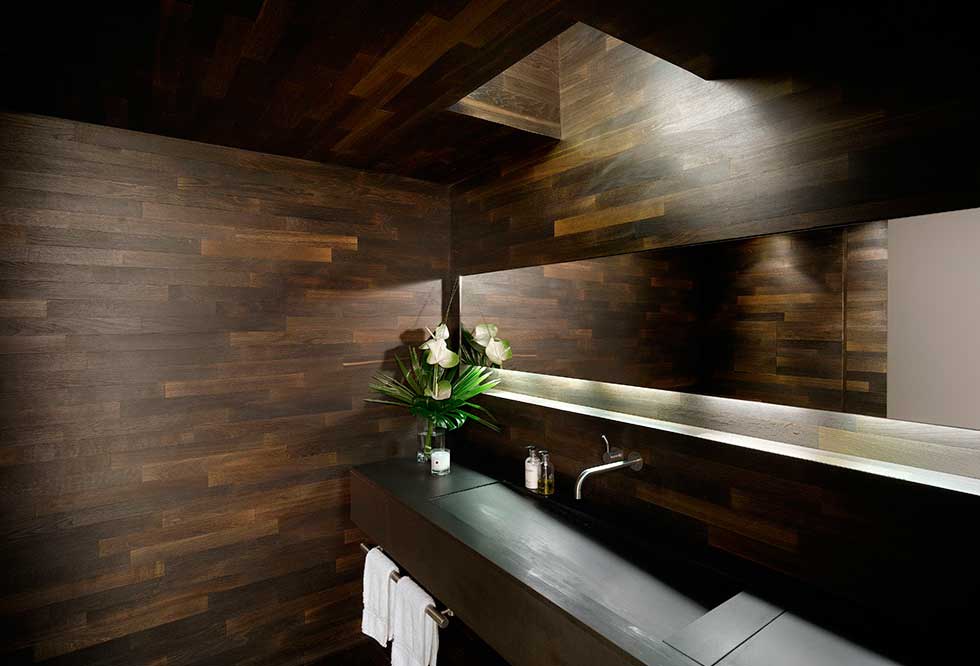 Dark wood panelling in a bathroom
