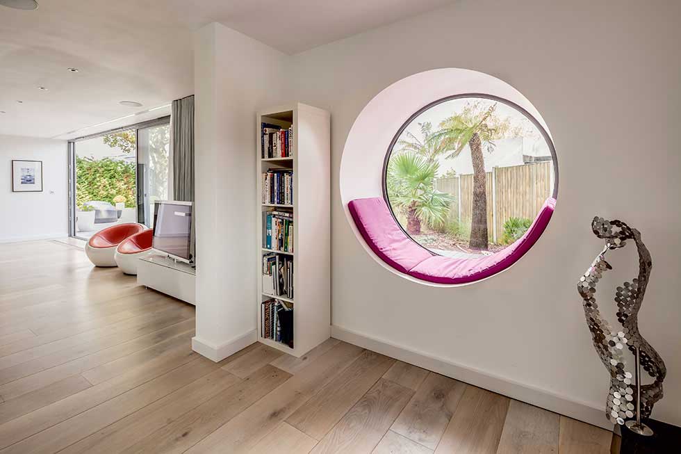 Circular window with built-in window seat