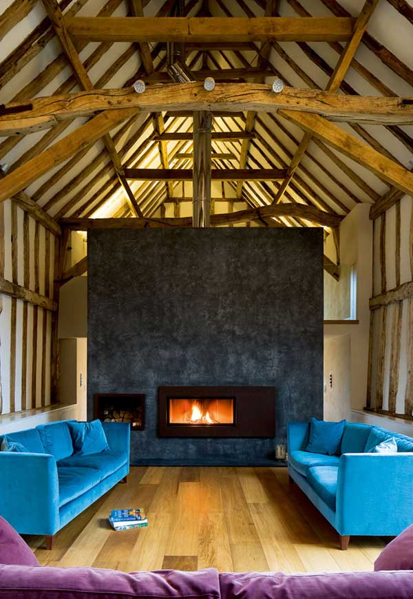 Tall fire surround in a barn conversion