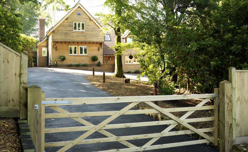 access to a plot of a oak frame home clad with timber