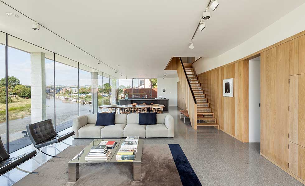 white open living space with large glass window walls