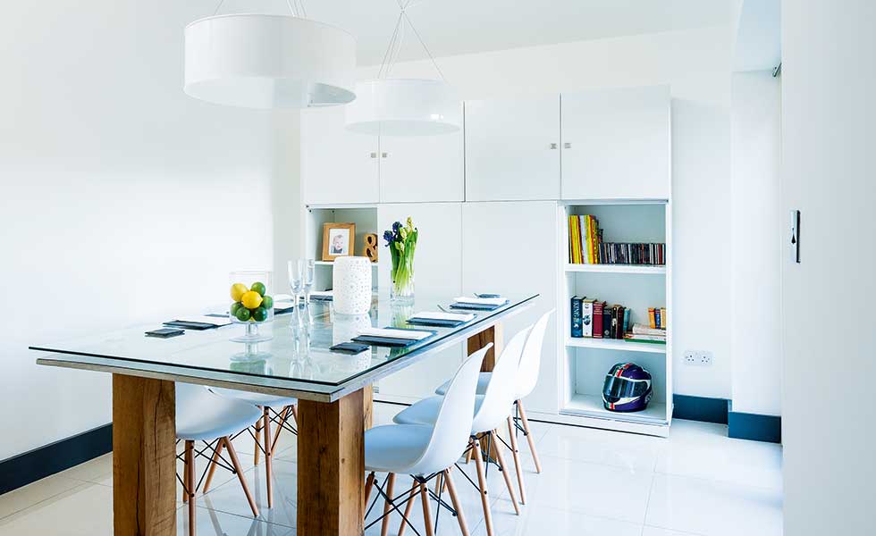 white modern kitchen with glass and wood table