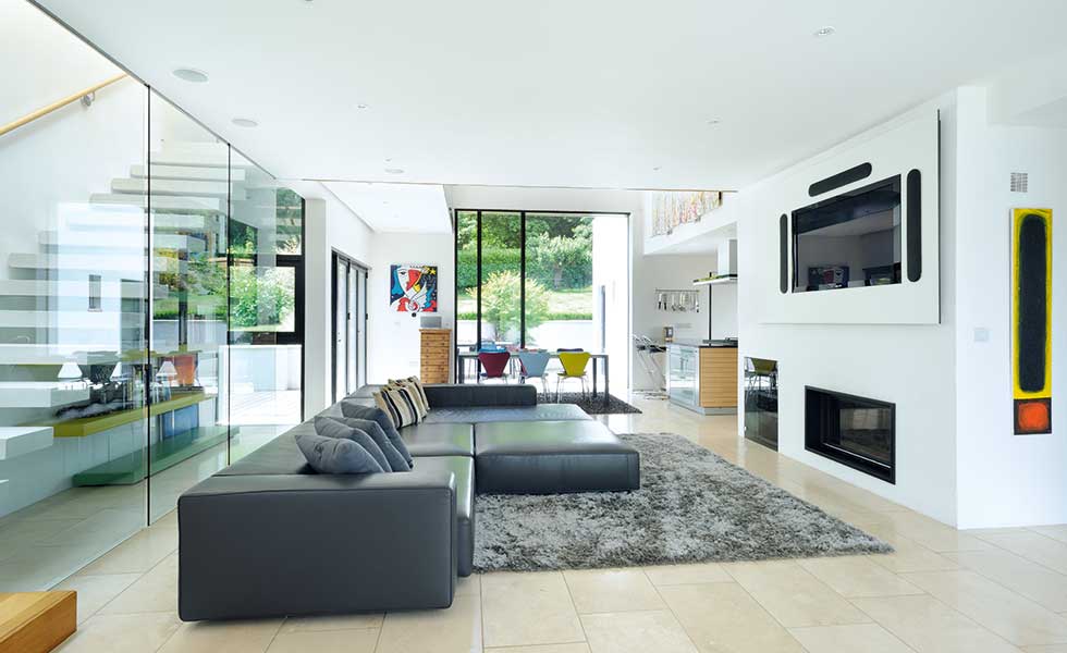 Living space separated from staircase by glass wall