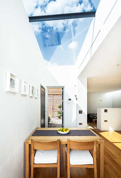 large rooflight over dining table of a small self build