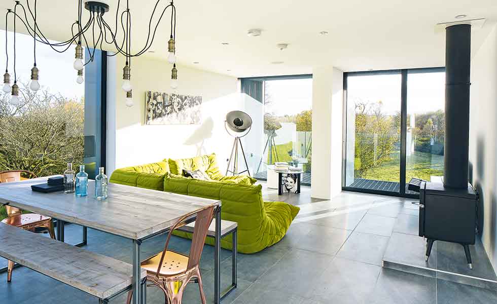 Large expanses of glazing bring light into this open plan home