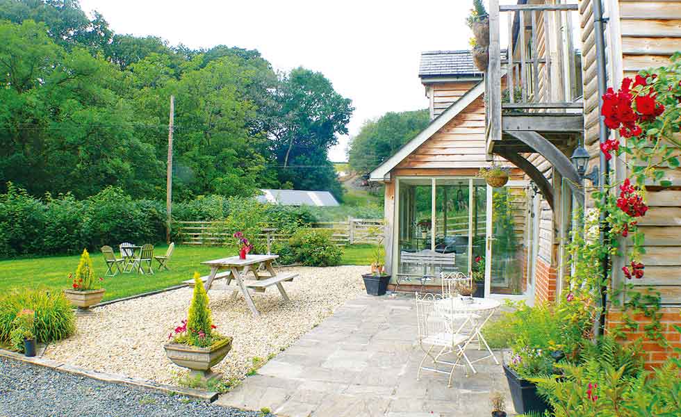 An L-shaped layout adds interest to an otherwise simple budget build in Wales