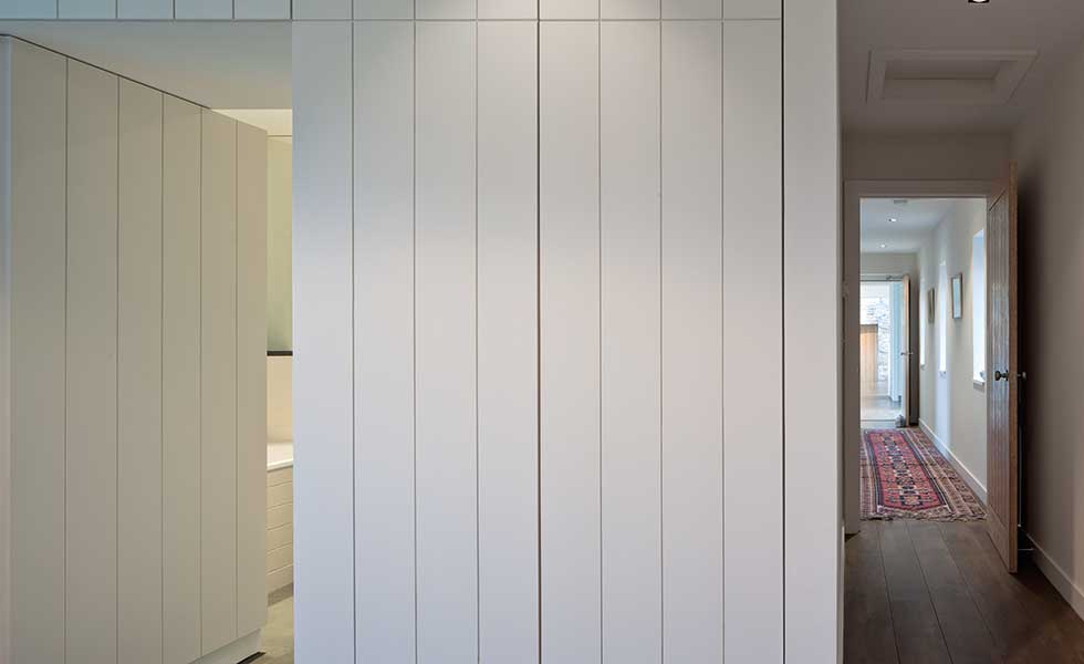 clad white walls of the bedroom