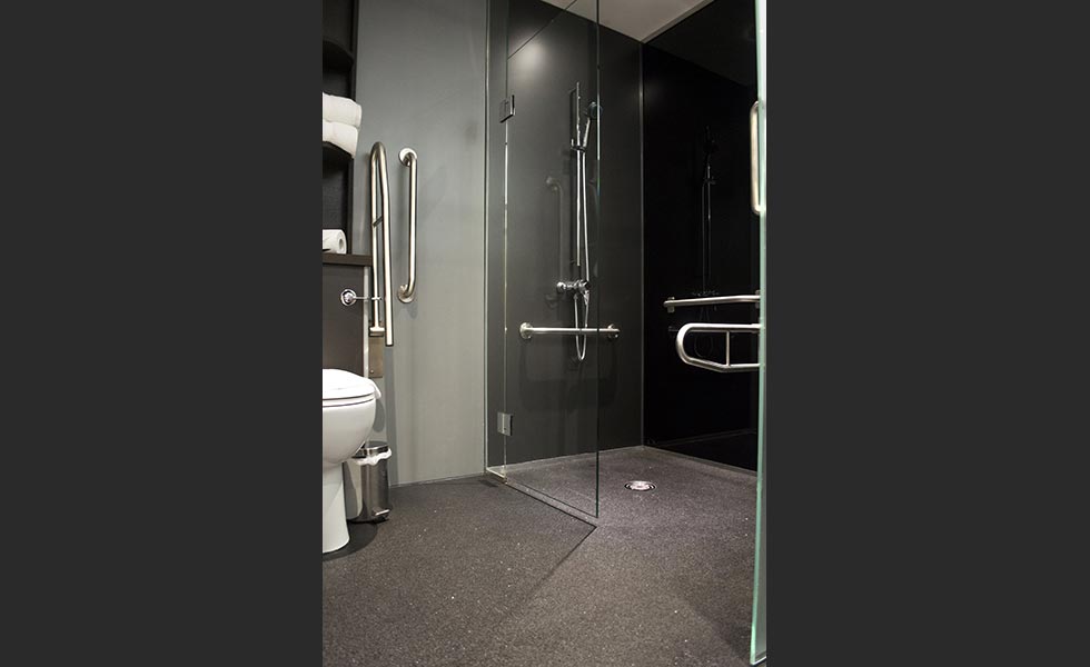 on the level Level access wet room design with vinyl flooring