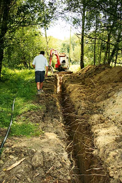 The tradesmen dig out the trenches ready to bring utility services to David and Bruce's self build projects