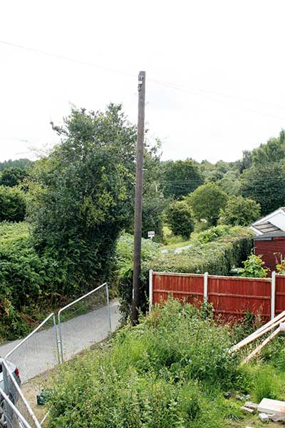 The telegraph pole is moved to David Snell's front garden on the corner of the self build plot