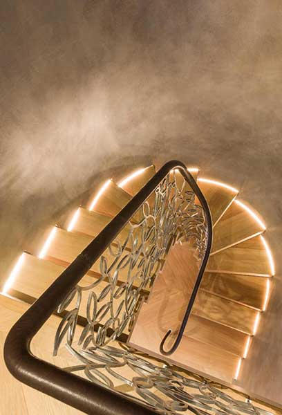 Illuminated treads on this Bisca staircase provide a warming glow