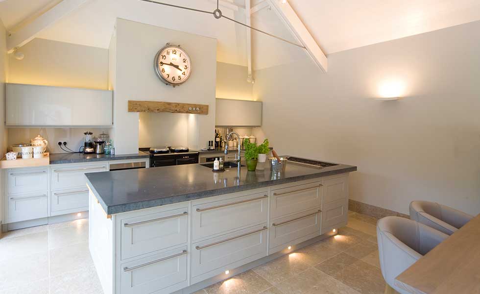 Layered lighting above unit and under the island has been used to great effect in this kitchen
