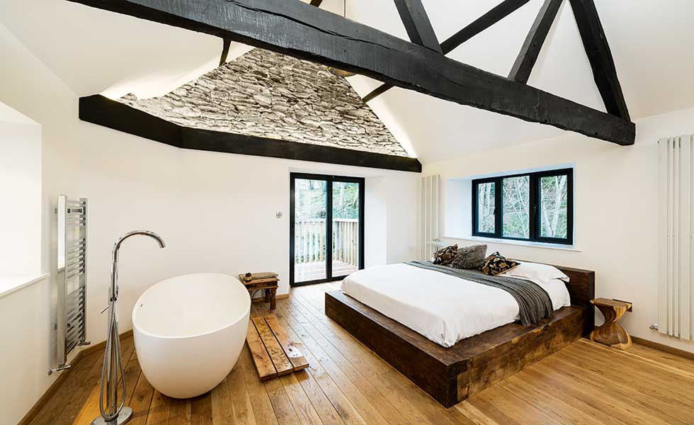 Strips of light illuminate the high ceilings in this converted mill
