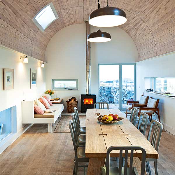 Dining-space-with-timber-clad-curving-ceiling